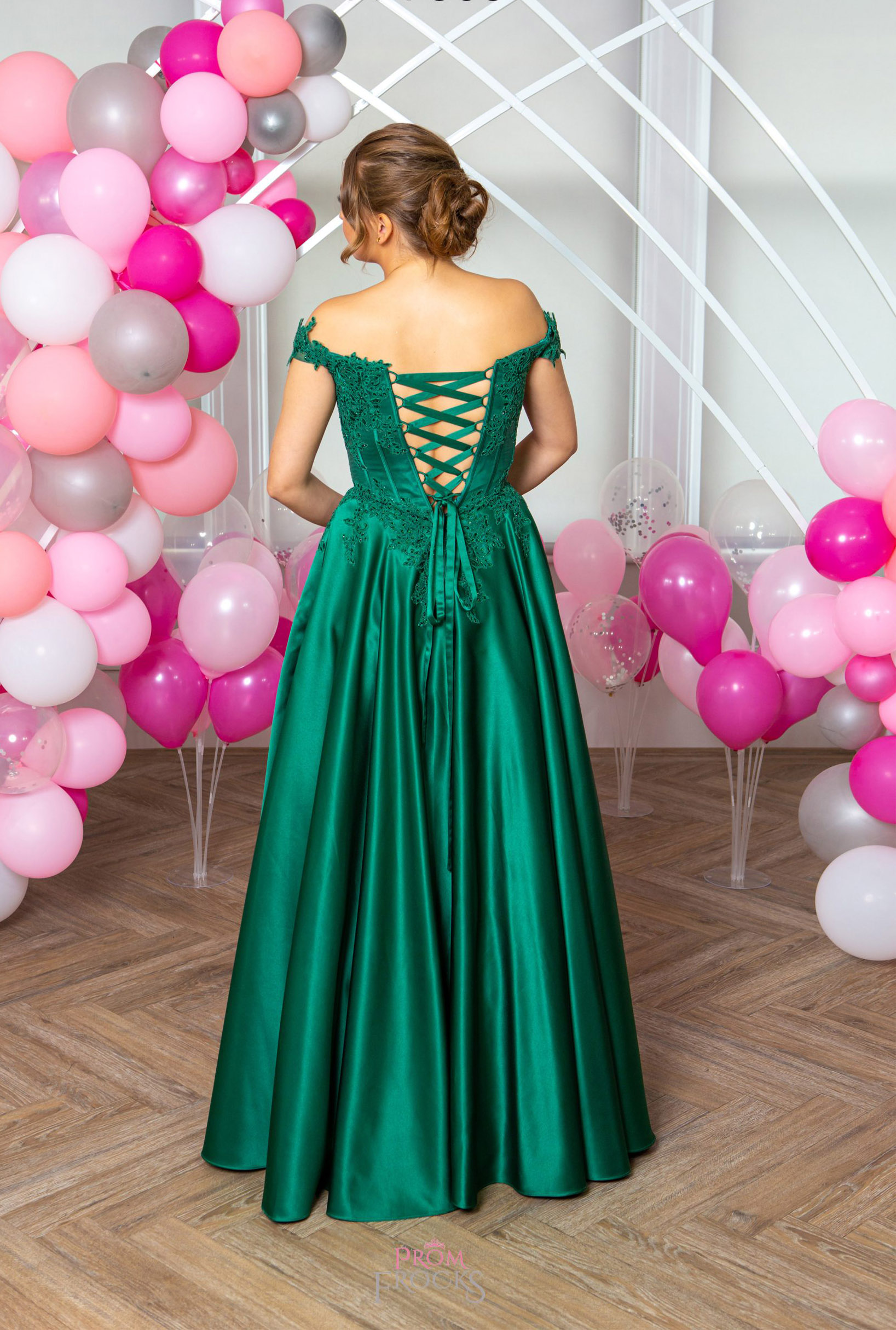 The rear view of festive Francesca dress combining elegance with flair in vibrant Emerald green