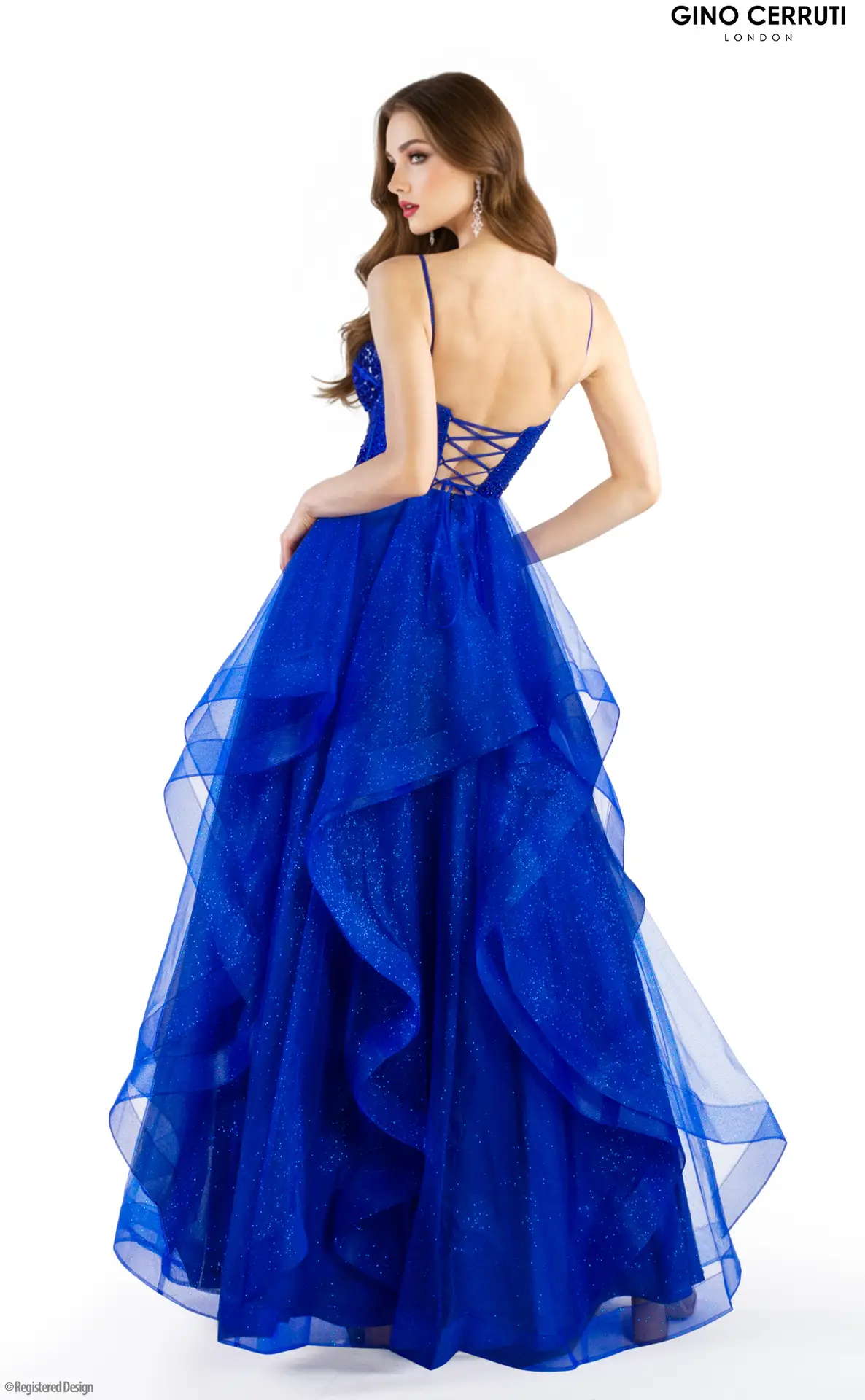 Amberly by Gino Cerruti (Royal Blue) Showstopping ballgown silhouette with glitter tulle layers Sweetheart neckline with structured corset-style bodice Bold royal blue sparkle finish Lace-up back with spaghetti straps Exclusive to MK Prom Bring the drama in Amberly by Gino Cerruti, now available in a breathtaking Royal Blue. T